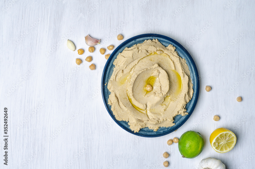hummus on white kitchen table hummus on white kitchen table