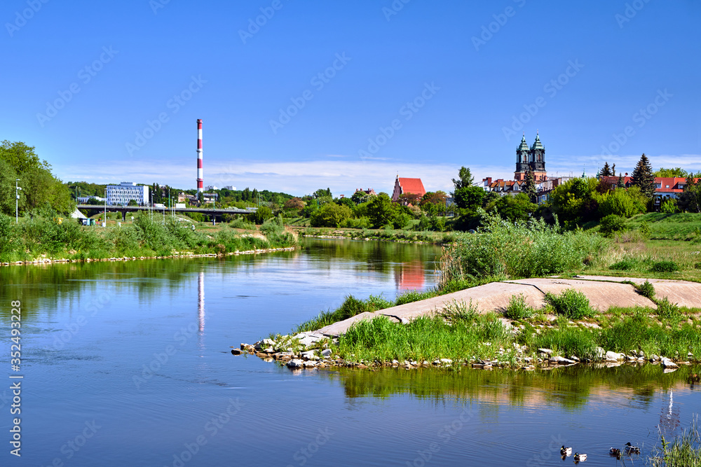 river Warta and the towers of historic cathedral  in Poznan.