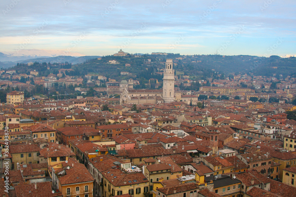 interesting view of verona from above with the bell towers and houses in the background
