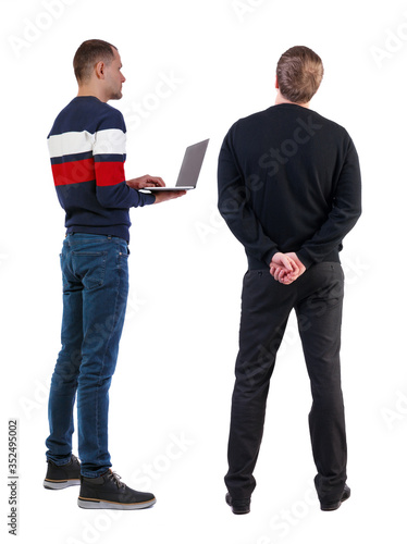 Back view two man in sweater with laptop.