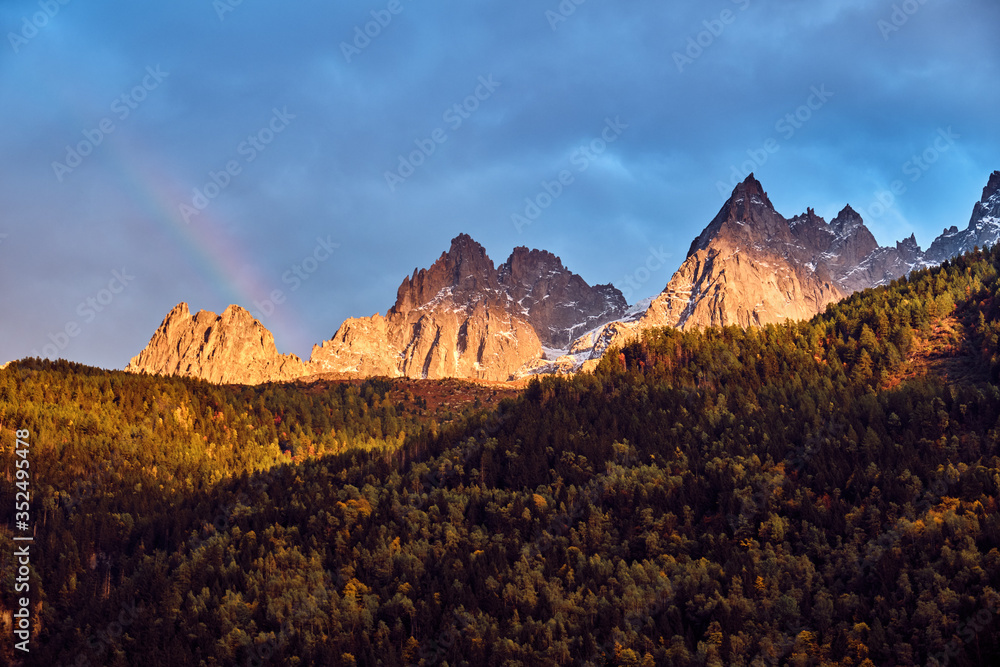 The sun shines on the rocky mountains. Landscape in the French Alps.