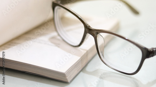 Black glasses on book  education  school