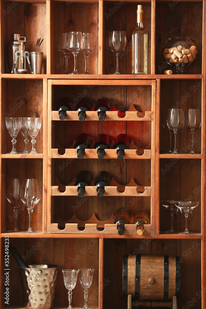 Bottles of wine and glasses in cellar