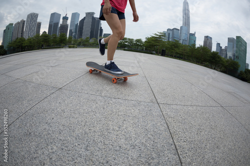 Skateboarder skateboarding at modern city