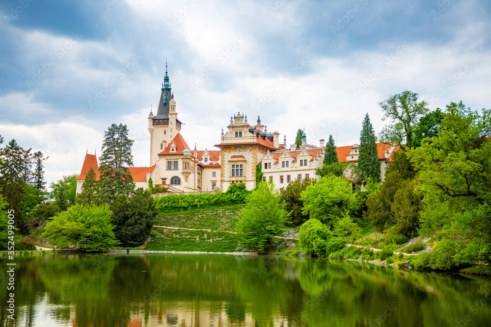 Castle with reflection in pond in spring time in Pruhonice, Czech Republic Castle with reflection in pond in spring time in Pruhonice, Czech Republic