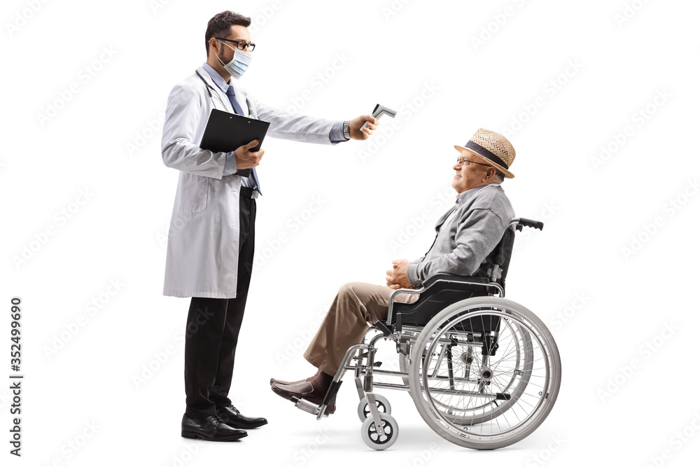 Male doctor with a thermometer measuring a temperature to an elderly man in a wheelchair Male doctor with a thermometer measuring a temperature to an elderly man in a wheelchair
