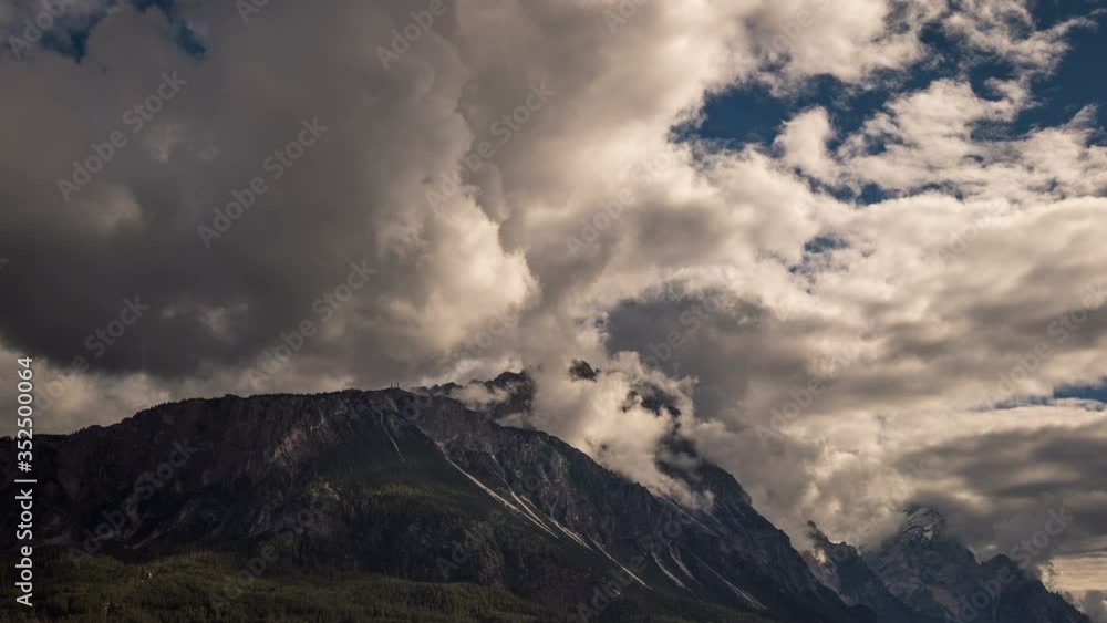 Time lapse of clouds passing over The Dolomite mountain peaks of Monte Cristallo near the town of Cortina in Italy Time lapse of clouds passing over The Dolomite mountain peaks of Monte Cristallo near the town of Cortina in Italy