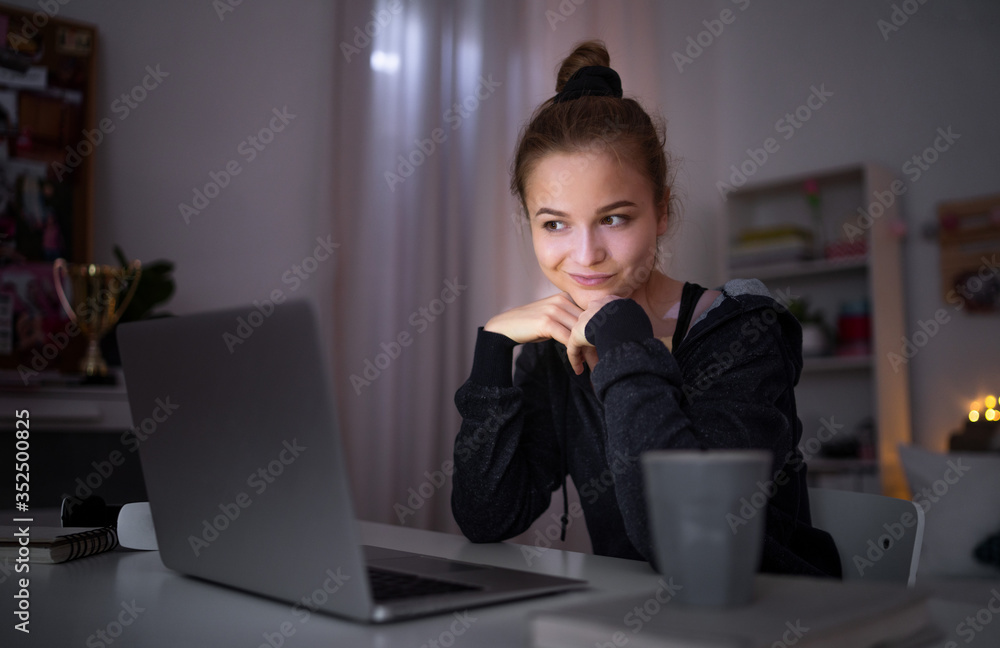 Beautiful happy young girl with laptop sitting and smiling, online dating concept. Beautiful happy young girl with laptop sitting and smiling, online dating concept.