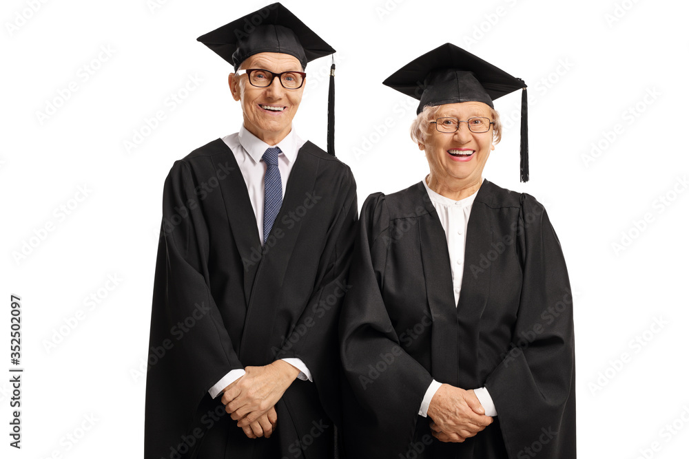 Elderly man and woman wearing a graduation gown and smiling Elderly man and woman wearing a graduation gown and smiling