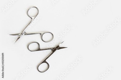 metal scissors for manicure and pedicure on a white background