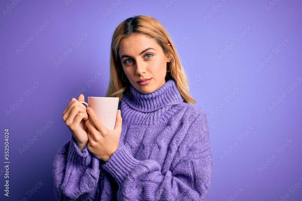 Young beautiful blonde woman drinking cup of coffee over isolated purple background with a confident expression on smart face thinking serious Young beautiful blonde woman drinking cup of coffee over isolated purple background with a confident expression on smart face thinking serious