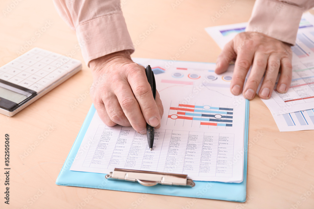 Male accountant working in office, closeup Male accountant working in office, closeup