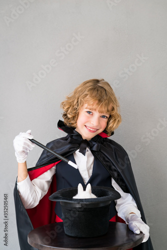 Child illusionist with cute rabbit