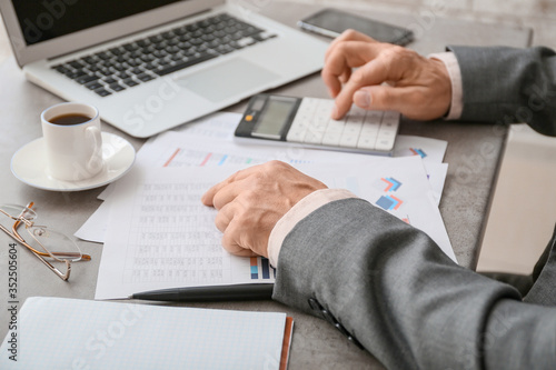 Male accountant working in ...