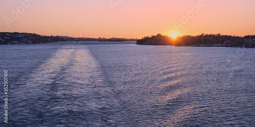 Photography Sea panorama of the Baltic Sea from the side of the ferry returning from the Swedish city of Stockholm at sunset time