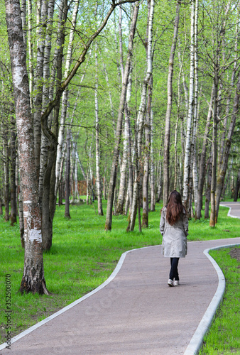 Wallpaper Mural a girl walking through the Park on a winding path Torontodigital.ca