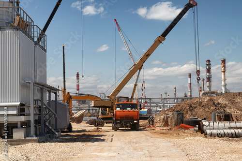 Construction site of an oil refinery with a large number of construction equipment