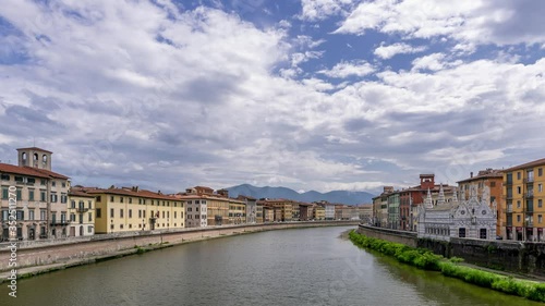 Beautiful view of the Lungarni of Pisa, Italy, of the historic center with the Church of Santa Maria della Spina from the Solferino bridge. Time lapse motion photo