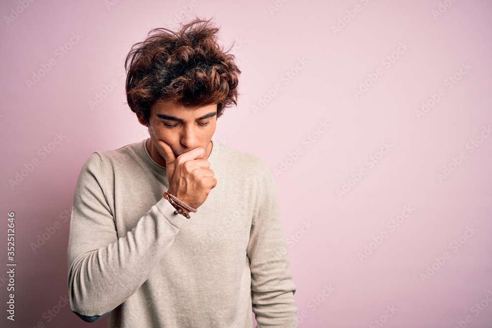 Young handsome man wearing casual t-shirt standing over isolated pink background feeling unwell and coughing as symptom for cold or bronchitis. Health care concept. Young handsome man wearing casual t-shirt standing over isolated pink background feeling unwell and coughing as symptom for cold or bronchitis. Health care concept.