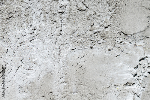 Grey concrete texture waal with shadows and highlites.