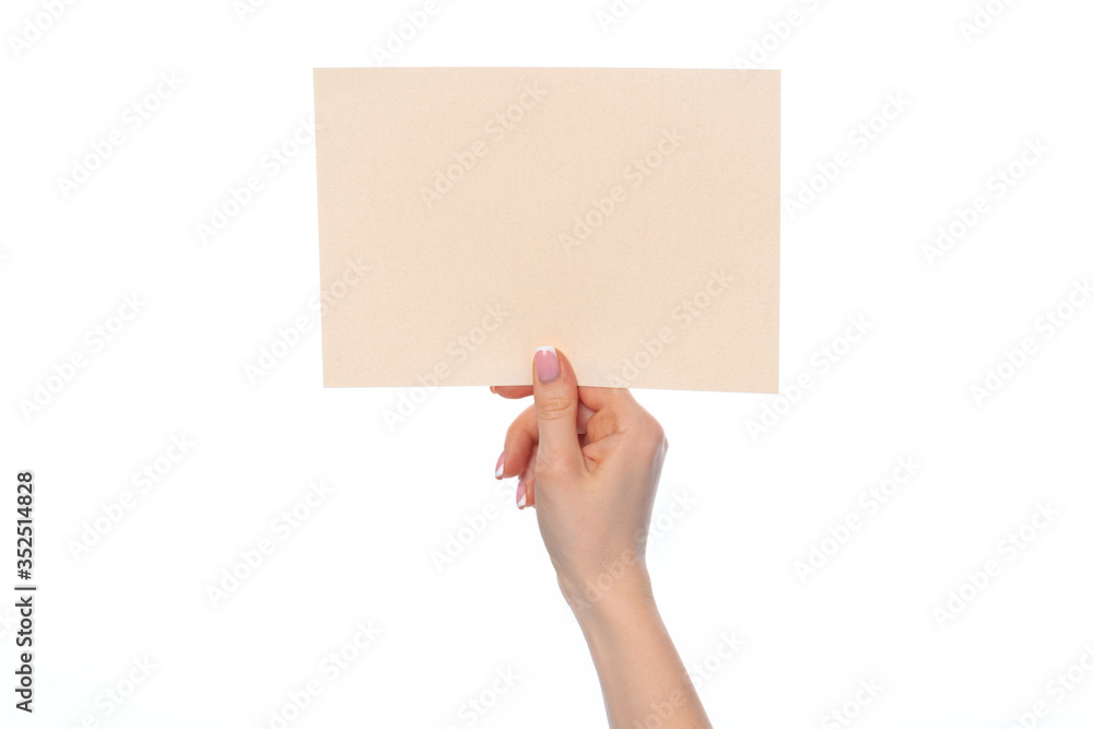 Craft paper card in female hand isolated on white Craft paper card in female hand isolated on white