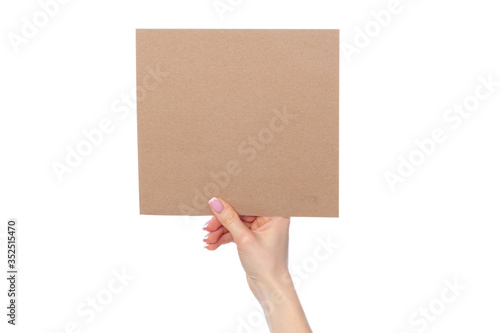Craft paper card in female hand isolated on white © fotofabrika