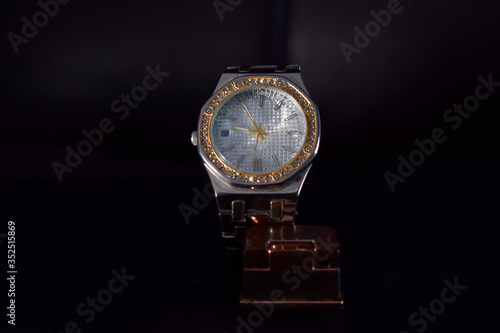 Stainless steel watch set with diamonds There are brands that are rare, expensive. Placed on the floor are classic vintage fashion accessories.