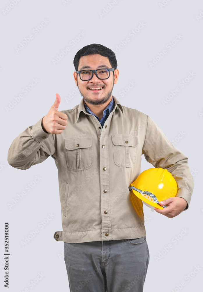 Young computer engineer asian man yellow hard hat and thumbs up Young computer engineer asian man yellow hard hat and thumbs up
