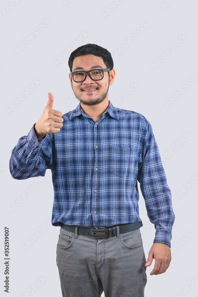 Asian men wear blue striped shirts happy smiling and thumbs up Asian men wear blue striped shirts happy smiling and thumbs up