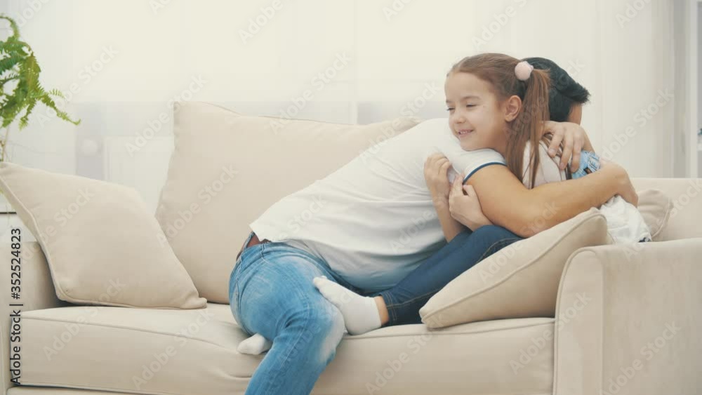4k slowmotion video where father holding child girl in his hands and hugging each other. 4k slowmotion video where father holding child girl in his hands and hugging each other.