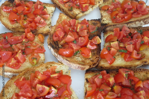 bruschetta browned bread with red cherry tomatoes