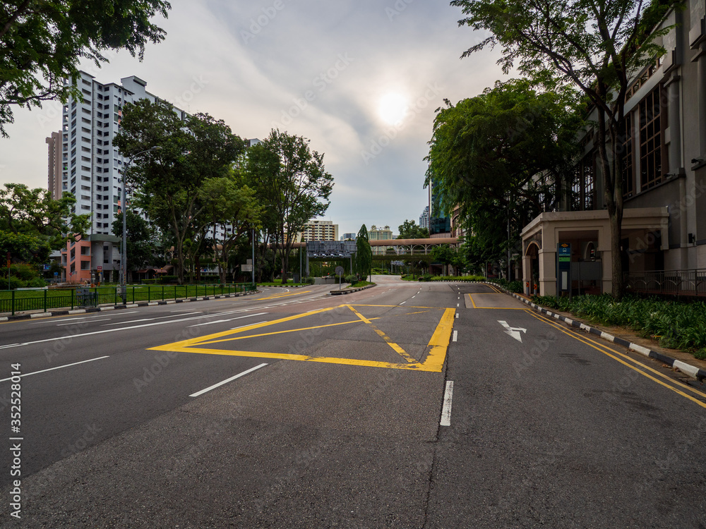 Quiet Singapore street with less tourists and cars during the city lockdown called