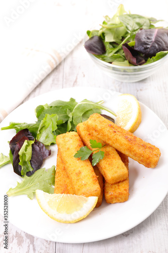 fried breaded fish with lettuce
