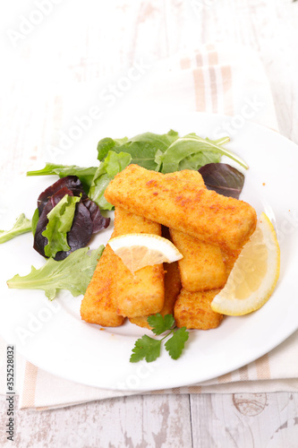 fried breaded fish with lettuce