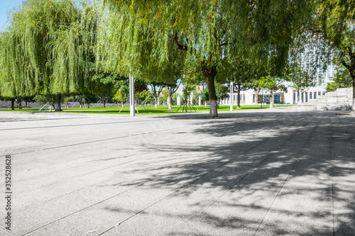 Empty street at the nice and comfortable great garden under lovely blue sky
