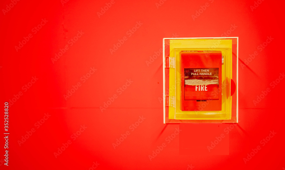 Quadro em tela The red fire alarm switch on the wall at the Bangkok subway..