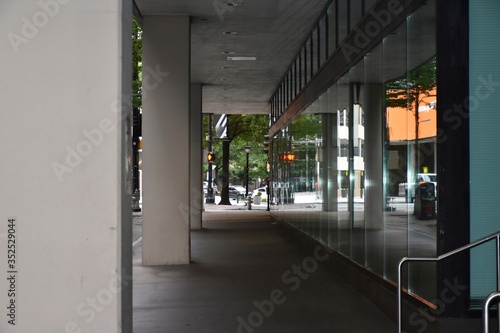 Outdoor pedestrian walkway with reflecting windows photo