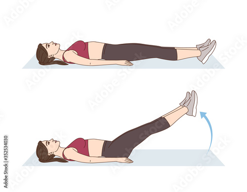 A woman is doing sports exercises. Leg raised. Workout for the abs and legs. Fitness for weight loss.