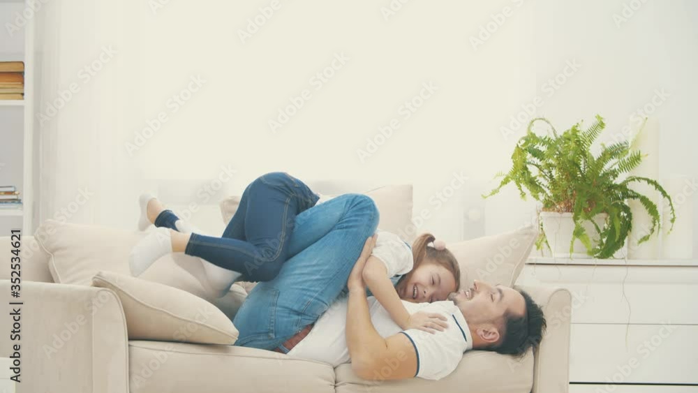 Single dad is trying to entertain his only daughter in 4k slowmotion video. Single dad is trying to entertain his only daughter in 4k slowmotion video.