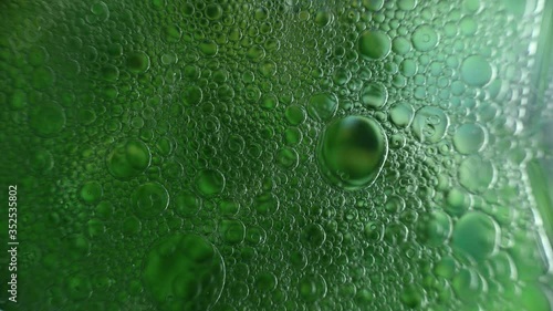 Colorful art of oil drops floating on a colorful gradient background