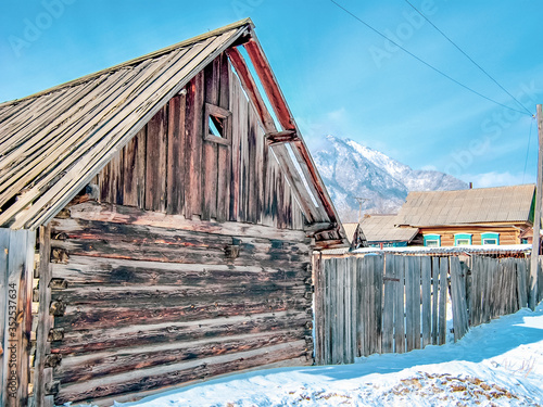 Village at the foot of the mountains in winter, winter background photo