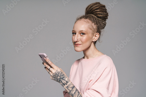 Portrait of an attractive young woman with dreadlocks photo