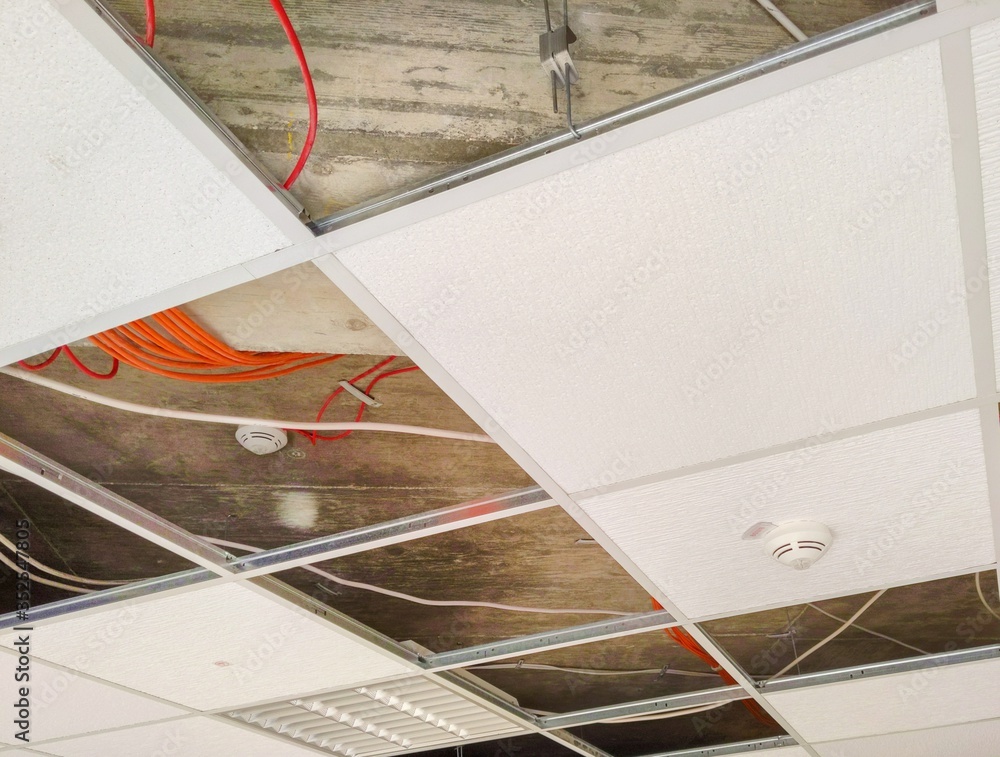Partially open suspended ceiling, with plenum area and wires visible