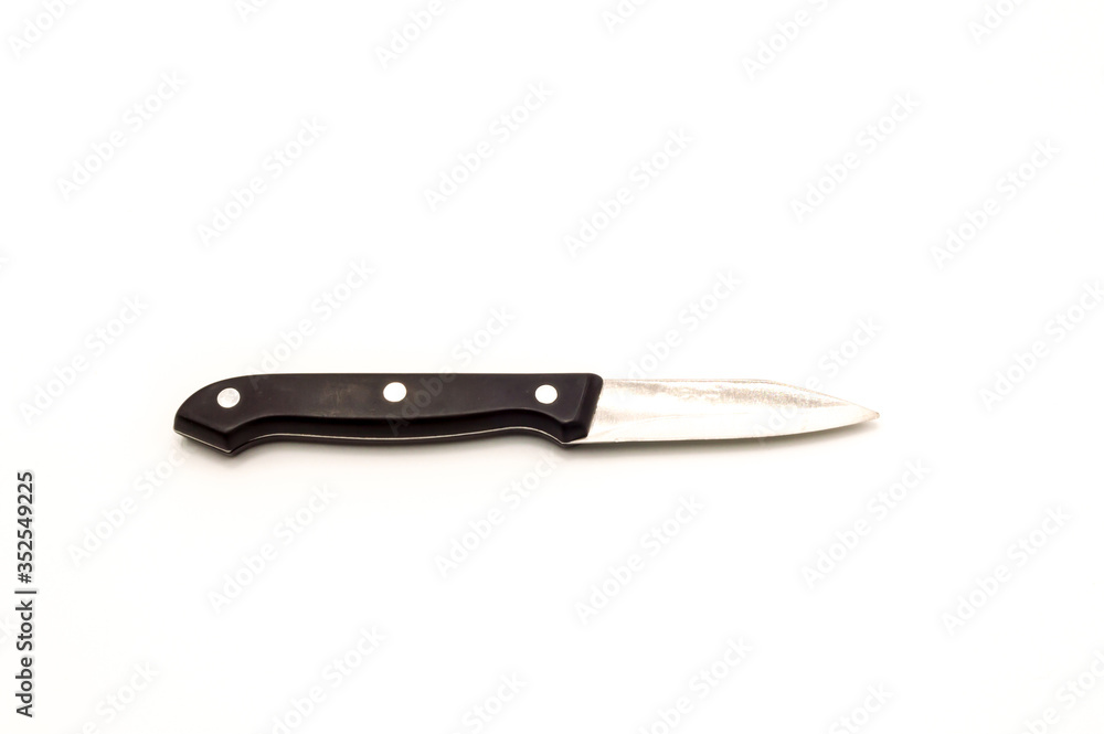 A small knife spins with a black wooden handle