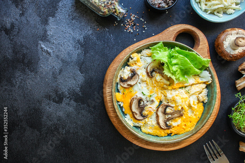 scramble fried eggs omelet mushroom concept healthy eating. food background top view copy space for text keto or paleo