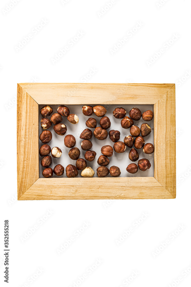 hazelnut nuts in a photo frame isolate on a white background
hazelnut nuts in a photo frame isolate on a white background