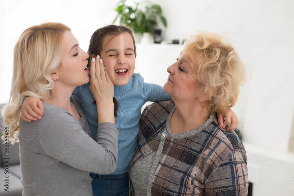 Portrait of three generations of women look at camera posing for family picture, cute little girl hug mom and granny enjoy time at home, smiling mother, daughter and grandmother spend weekend together Portrait of three generations of women look at camera posing for family picture, cute little girl hug mom and granny enjoy time at home, smiling mother, daughter and grandmother spend weekend together