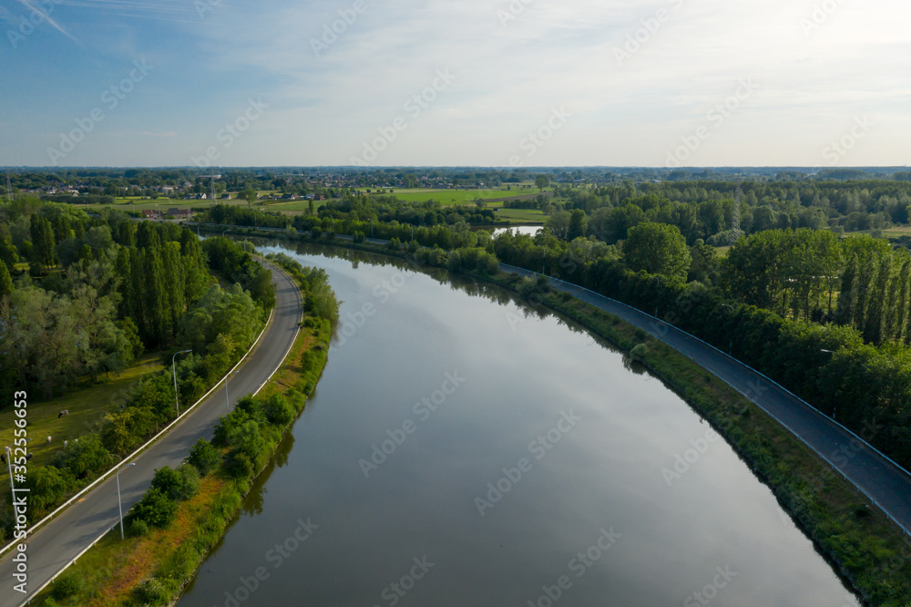 Aerial view of the Dender river, while passing the town of Dendermonde, in Belgium Aerial view of the Dender river, while passing the town of Dendermonde, in Belgium