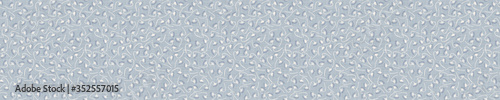 Seamless tossed floral border pattern. French blue linen shabby chic style. Hand drawn country bloom banner. Rustic woven background. Kitchen towel home decor swatch. Simple flower ribbon trim edge.
