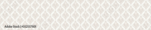 Seamless ornate medallion border pattern in french cream linen shabby chic style. Hand drawn floral damask bordure. Old white blue background.  Interior home decor edging. Ornate flourish ribbon trim